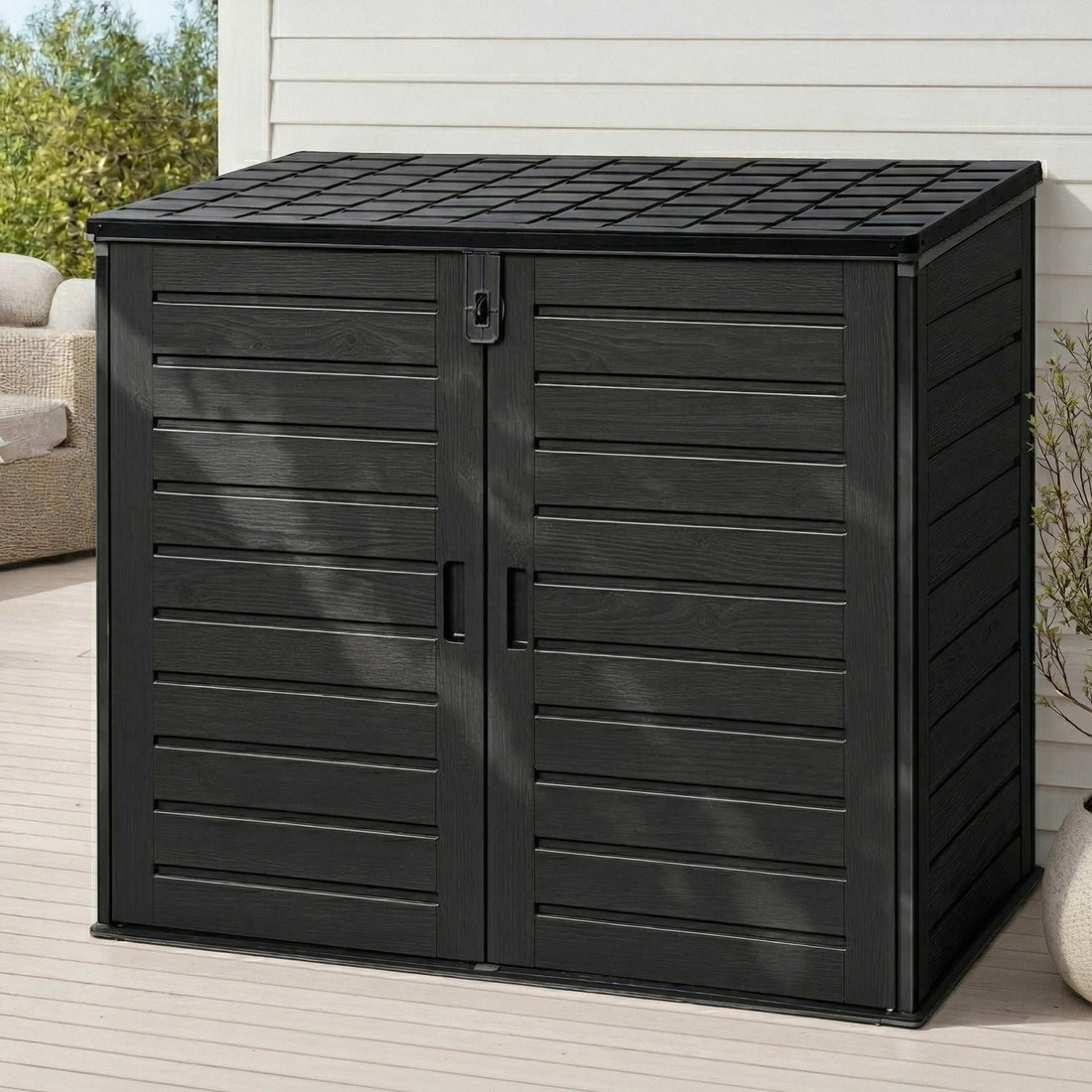 Gardeon 1170L lockable outdoor storage box in black on a patio