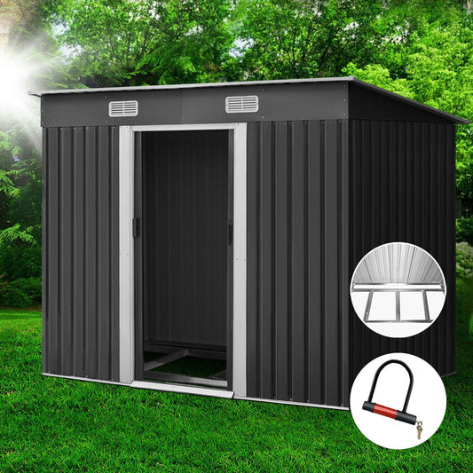 Giantz garden shed with an included metal base on level ground
