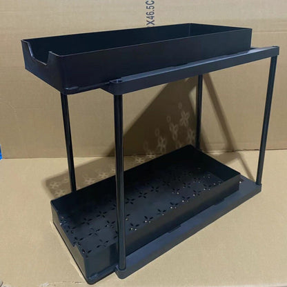 Two-tier pull-out storage rack. An organizational lifesaver for under the kitchen sink. Features adjustable shelves for easy storage of bottles and jars. In a sleek, modern design. Perfect as a kitchen shelf, bathroom organizer, or household storage solut
